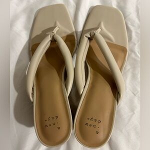 a new day women’s size 10 cream colored heel sandals w/squared toe.